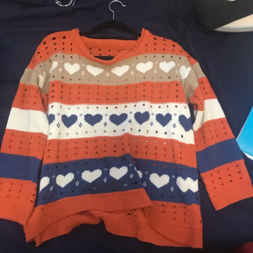 Orange and blue sweater with hearts